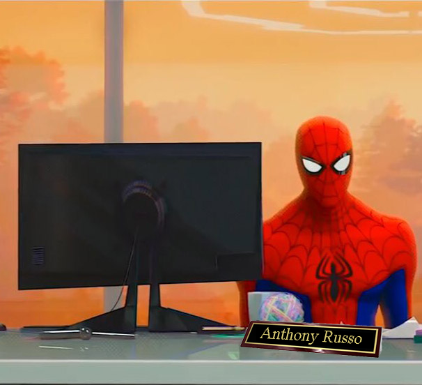 Spiderman sitting at a desk.
